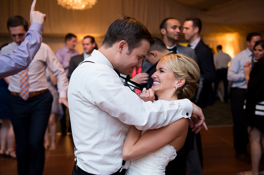 Bride and groom excited on the dance floor.