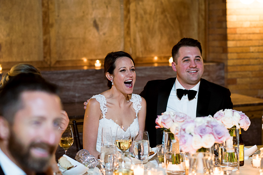Bride reacts to a speech.